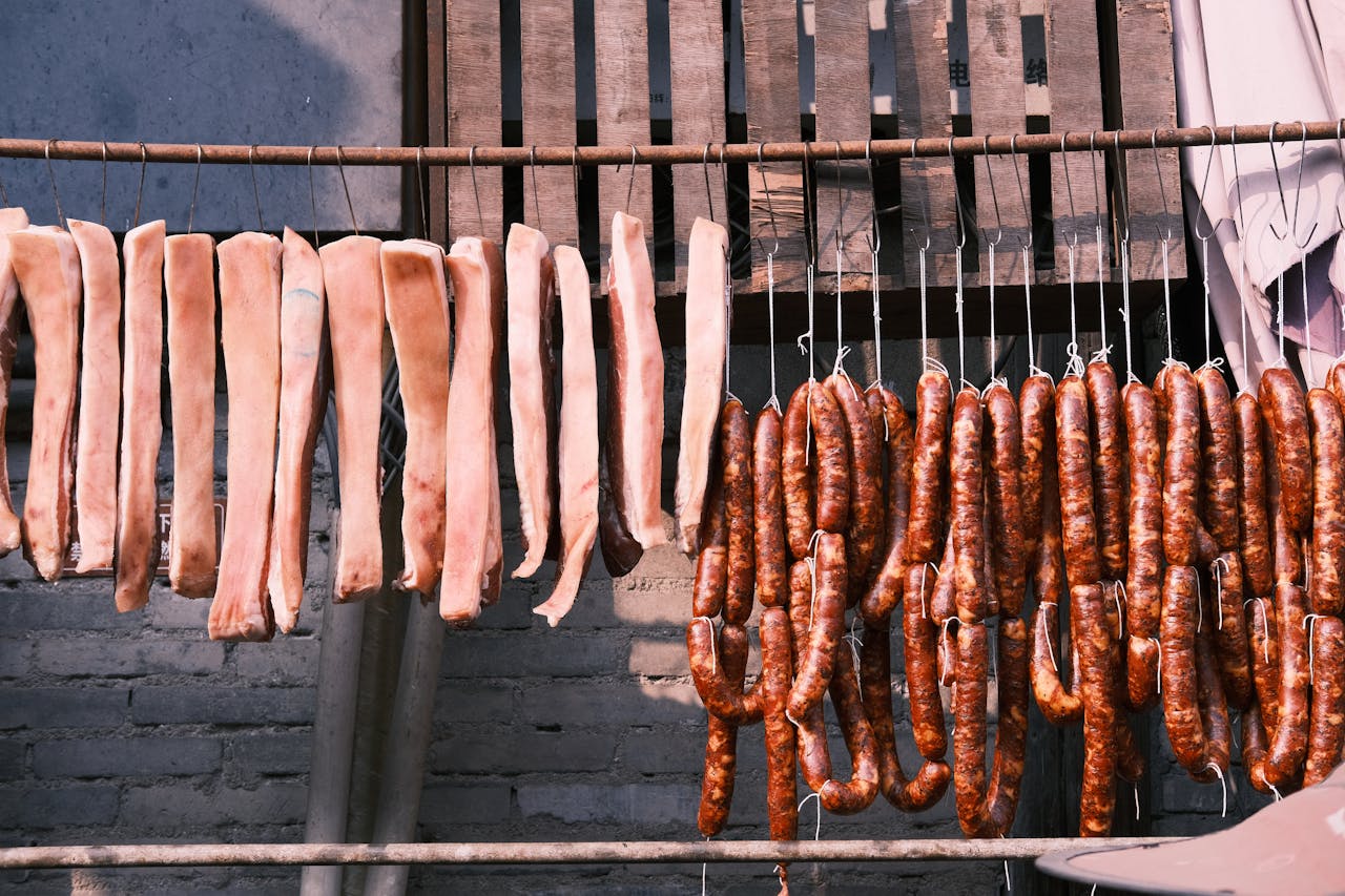 Meat Hanging Off a Bar